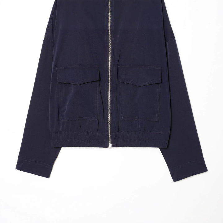 Women's short utility blouson jacket with standing collar, patch chest pockets, full zip, and elastic hem Mune Fashion