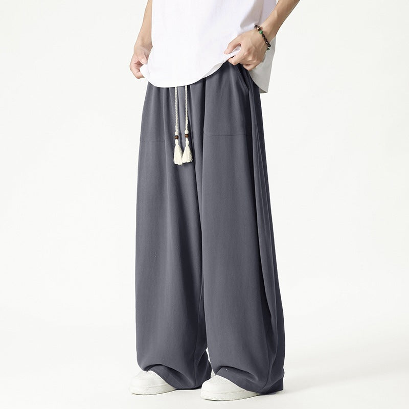 Men's loose-fitting lounge pants with tassel cord, elastic waistband, and patch pockets Mune Fashion