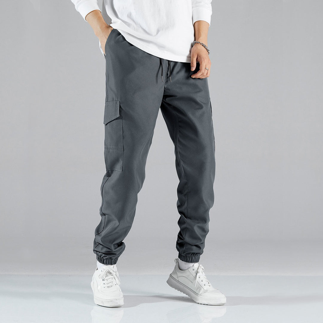 Women's casual cargo pants with elastic drawstring waistband, flap pockets, and adjustable ankle ties Mune Fashion