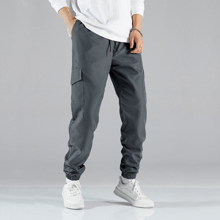 Women's casual cargo pants with elastic drawstring waistband, flap pockets, and adjustable ankle ties Mune Fashion