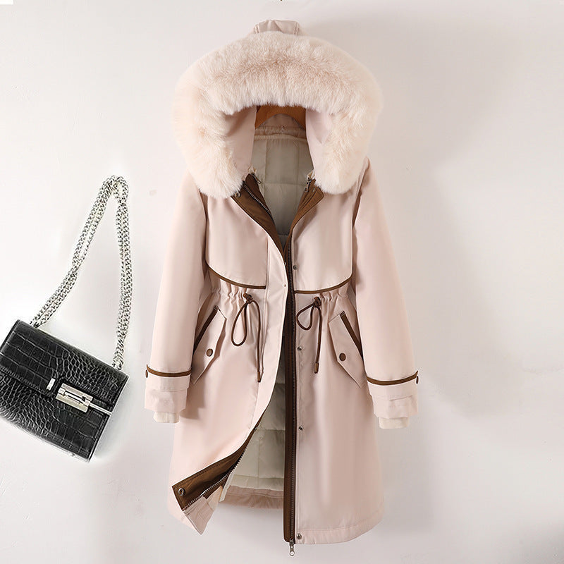 Women's long parka with faux fur hood, waist drawstring, and contrasting piping Mune Fashion