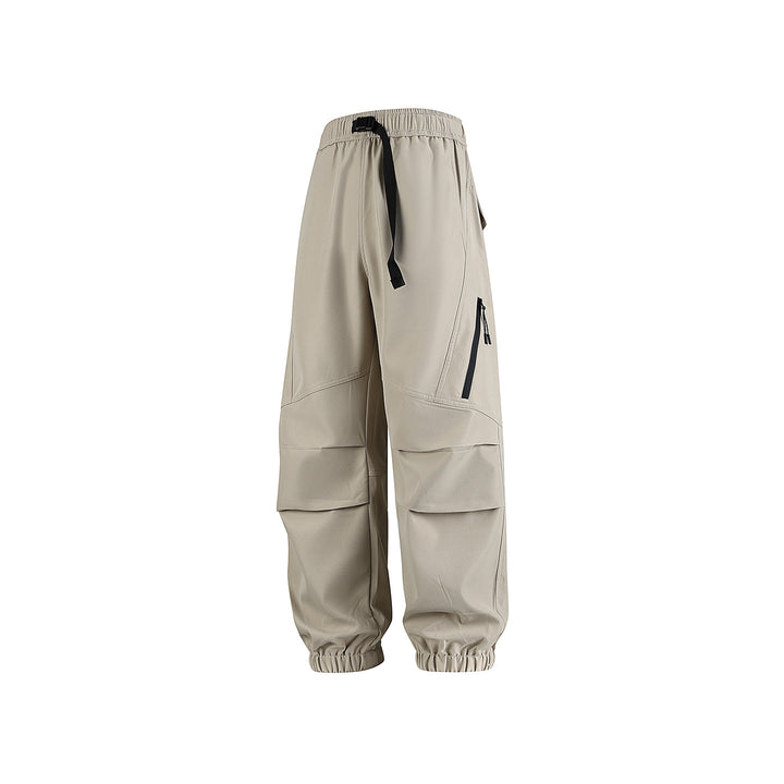 Men's loose technical cargo jogger pants with elastic drawstring waistband, patch flap pockets, and zippered leg pocket Drune