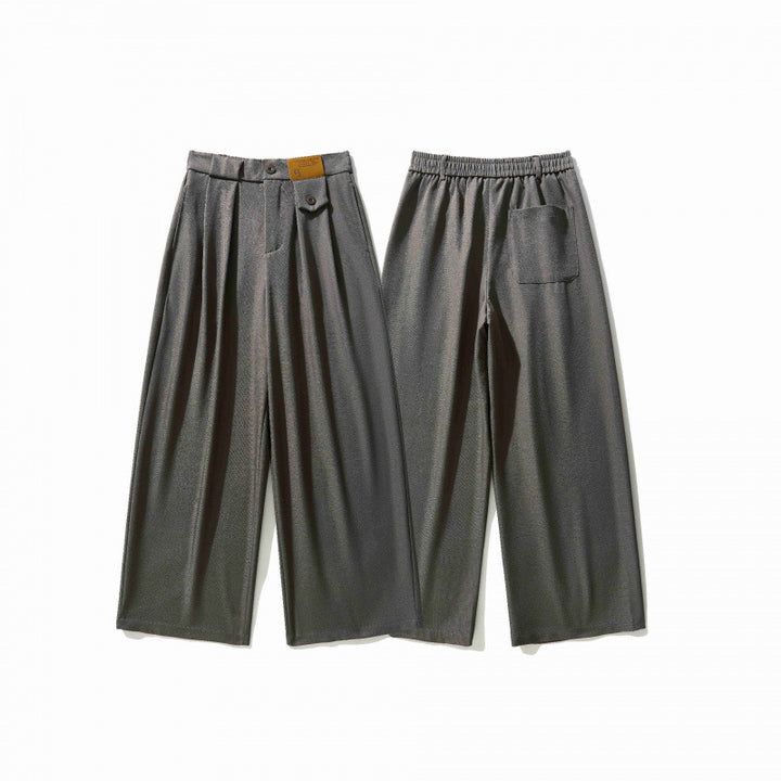 Women's wide culotte pants with knife pleats, high waistband, and decorative button detail Mune Fashion