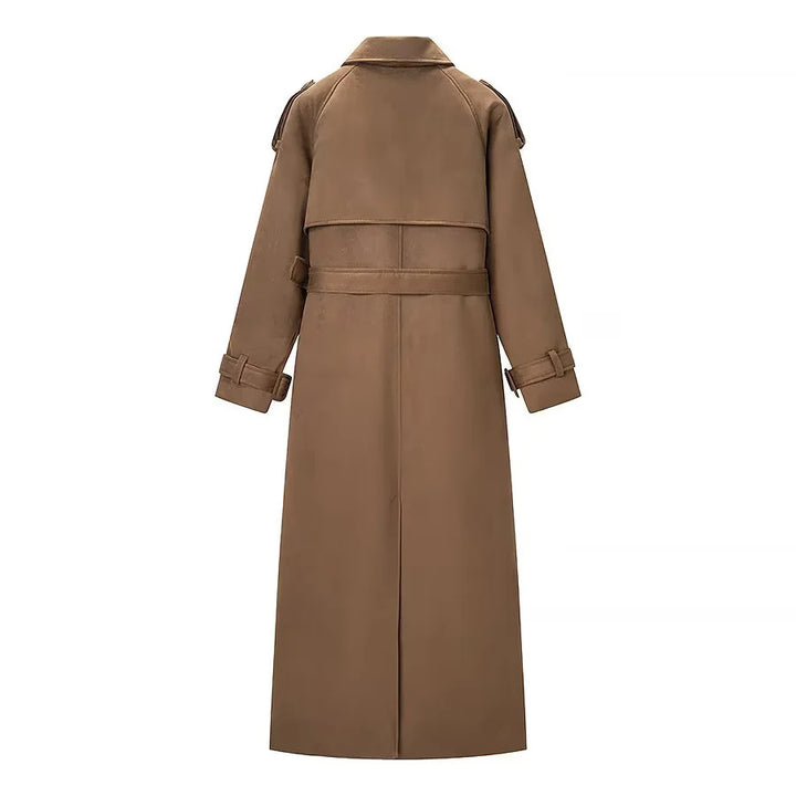 Ladies long trench coat with double-breasted front, waist belt, epaulettes, and cuff detail Mune Fashion
