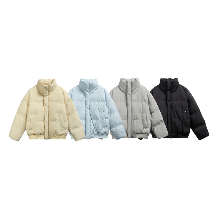 Women's short padded quilted jacket in boxy cut with high stand-up collar and ribbed hem Mune Fashion