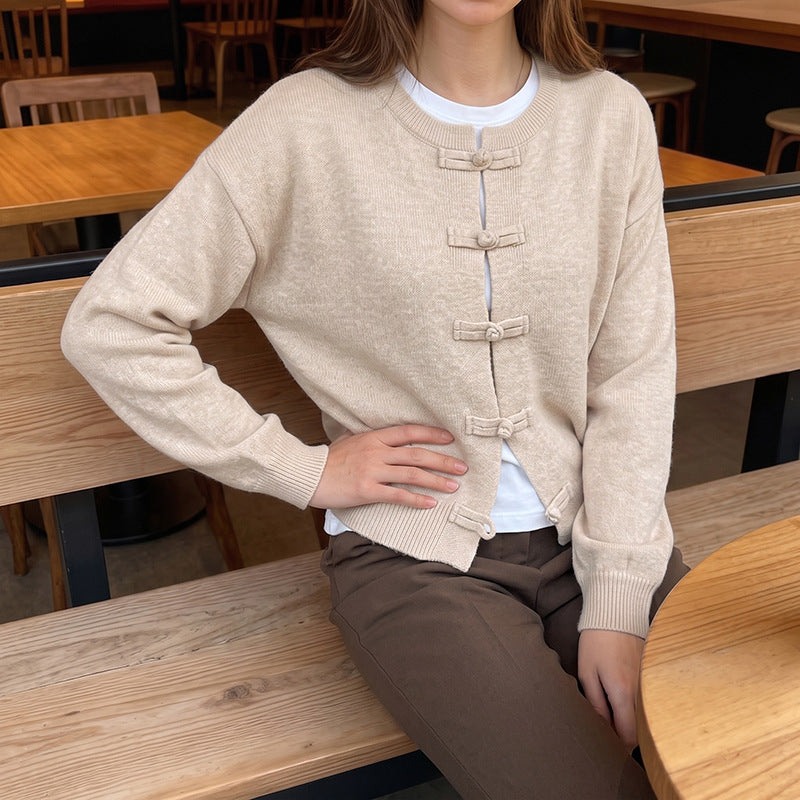 Women's fine knit cardigan with decorative knot closure and casual raglan silhouette Mune Fashion