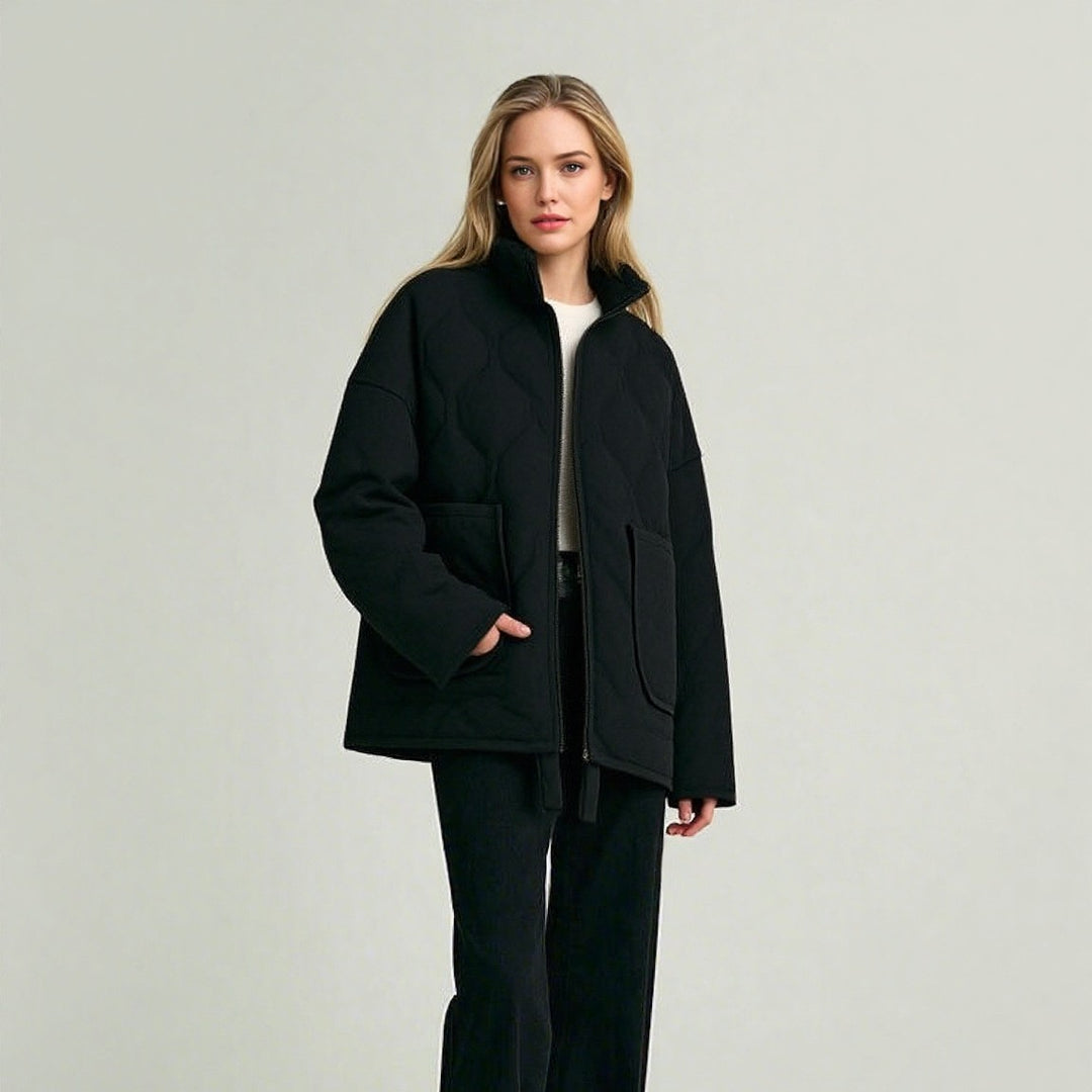 Men's quilted transition jacket with stand-up collar, two appliquéd round pockets, and drawstring hem Mune Fashion