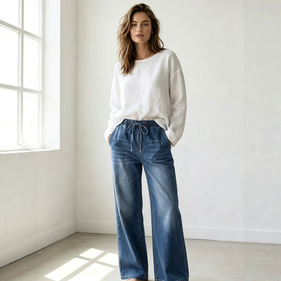 Women's Relaxed-Fit Denim Pants with elastic drawstring waistband, subtle used effect, and wide leg Mune Fashion
