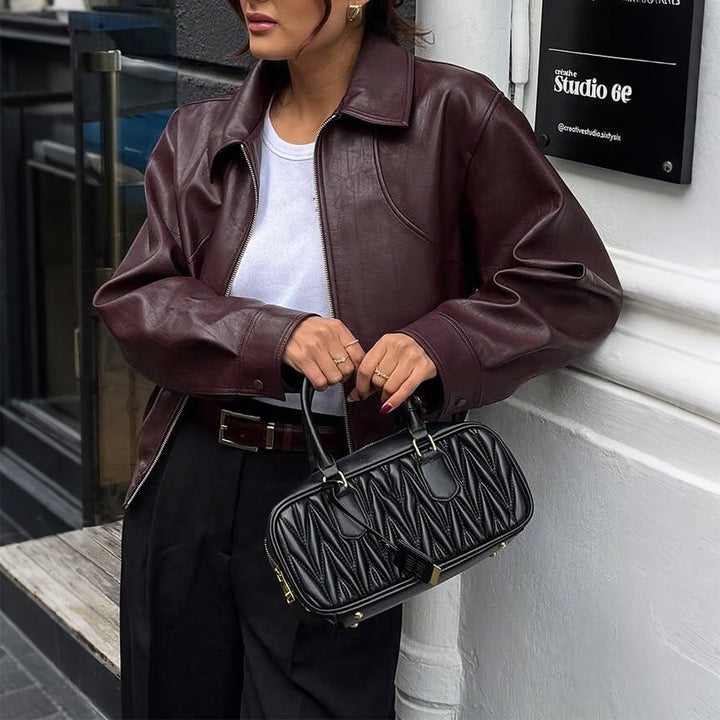 Women's short oversized leather jacket with shirt collar, visible zipper, and casual silhouette Mune Fashion