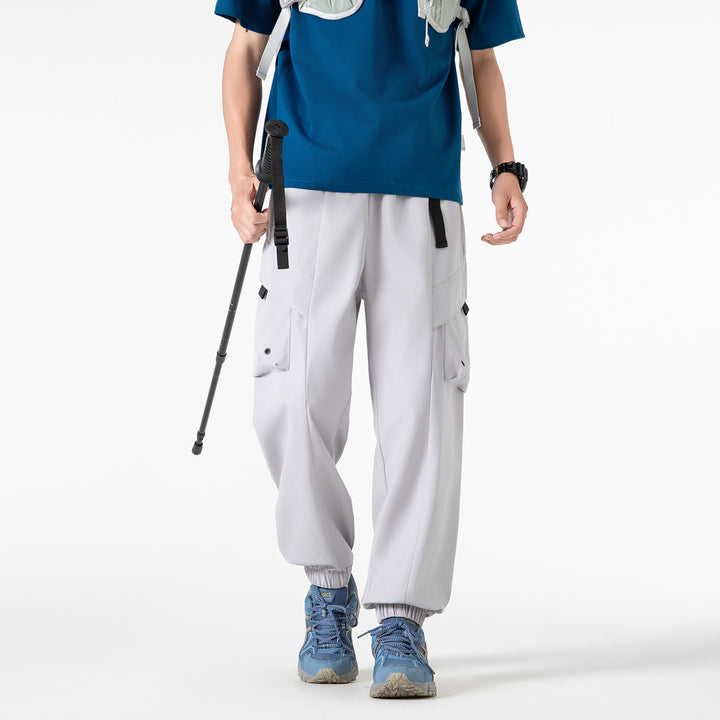 Men's loose cargo jogger pants with elastic drawstring waistband, multiple flap pockets, and ribbed ankles Drune