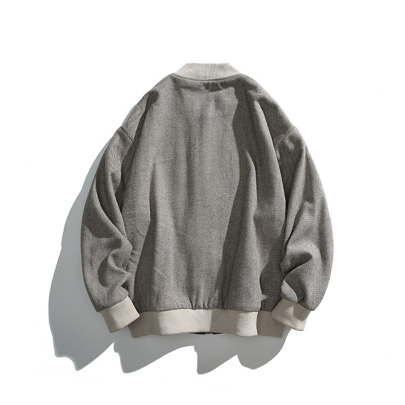 Unisex boxy bomber jacket in herringbone look with ribbed cuffs, flap pockets, and concealed snap button placket Mune Fashion