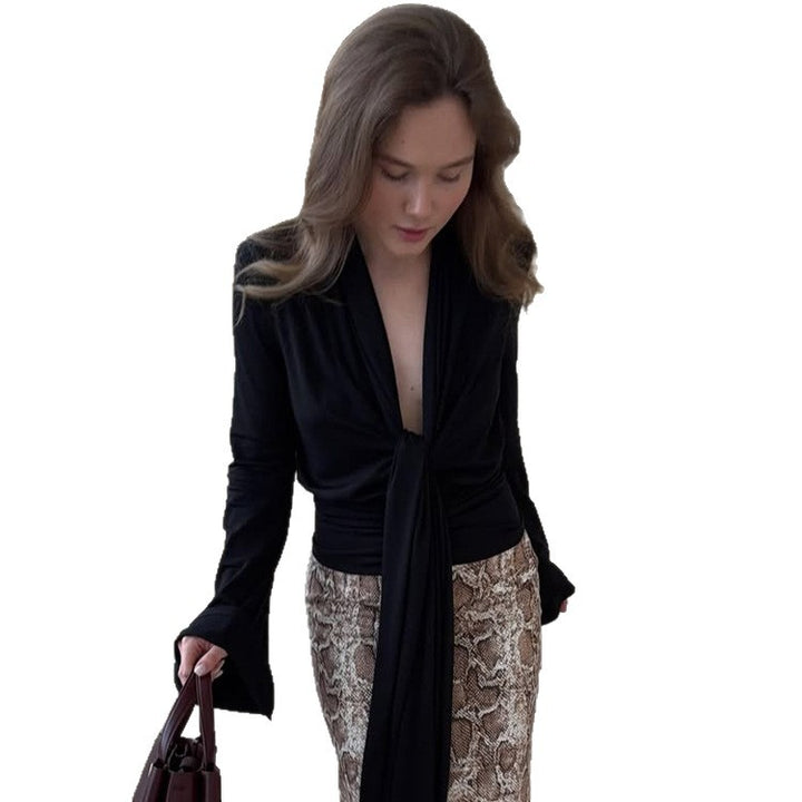 Women's wrap blouse with deep V-neck, long tie ribbons and ruffle sleeves Mune Fashion