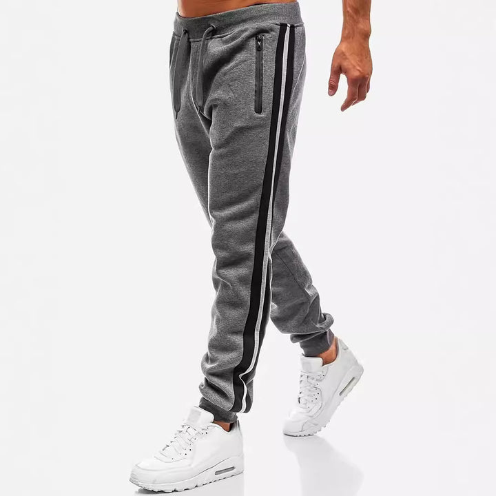 Men's narrow tapered fleece jogging pants with two-tone side piping and water-repellent zip pockets Mune Fashion