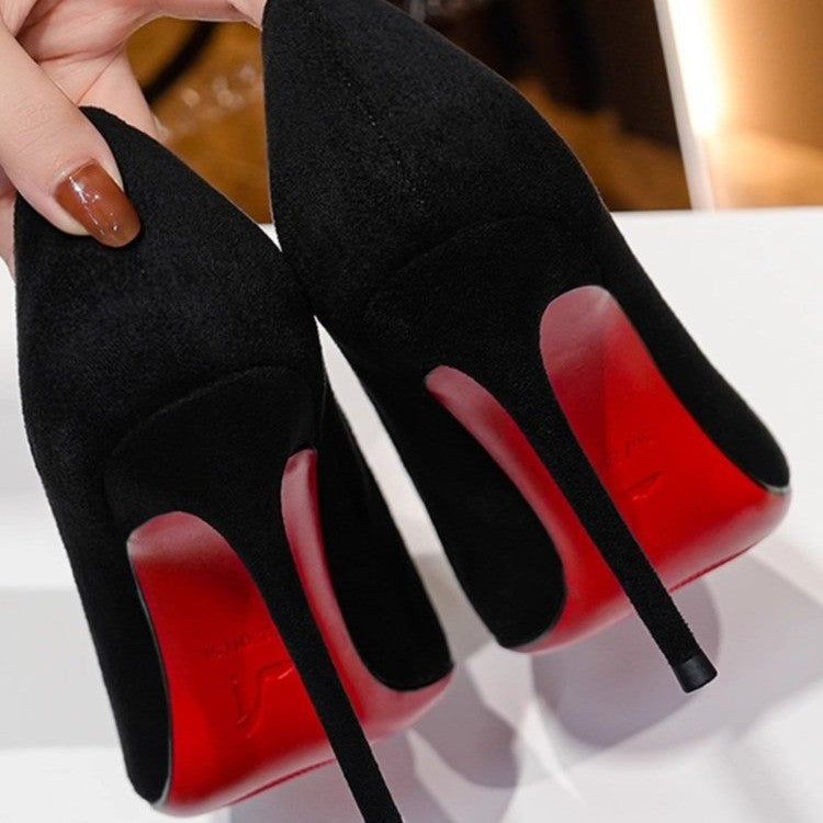 Ladies elegant pointed suede pumps with contrasting red sole and narrow stiletto heel