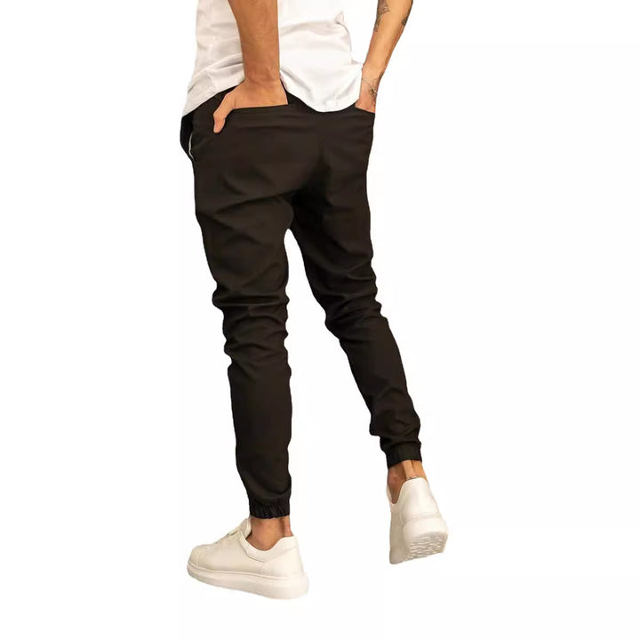 Men's slim fit jogging pants with elastic waistband, drawstring, and ribbed ankle cuff Mune Fashion