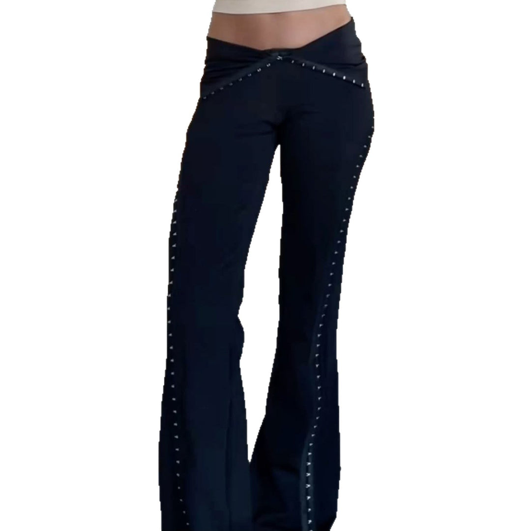 Women’s flared trousers with V waistband, side insert panels and decorative rivets Mune Fashion