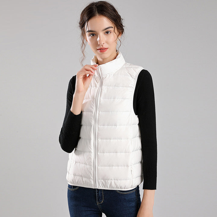 Women's packable quilted vest with flat down look, stand-up collar and side slip pockets Mune Fashion