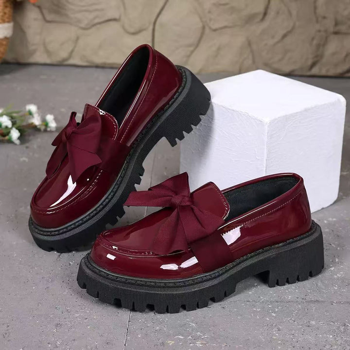 Ladies patent loafers with distinctive profile sole and decorative bow Mune Fashion