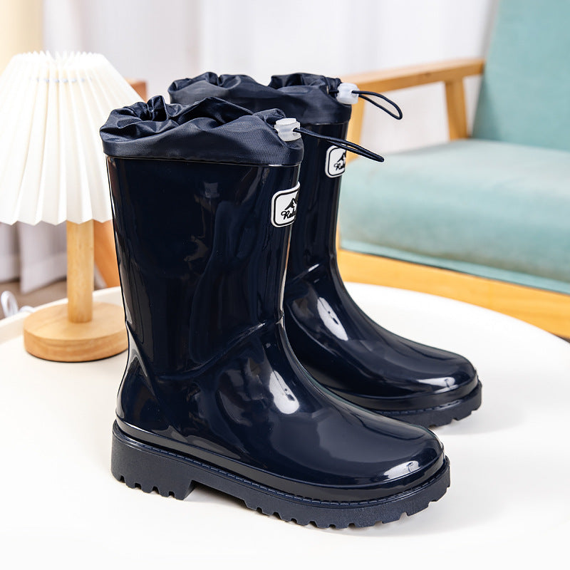 Women's Shiny ankle-high rain boots with drawstring and non-slip profile sole Mune Fashion