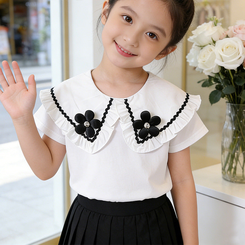 Girl's blouse with ruffled hem and floral design Mune Fashion