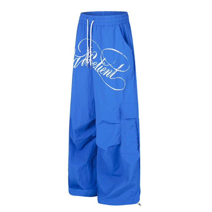 Women's wide palazzo cargo pants with elastic drawstring waistband, large flap pockets, and statement writing print Mune Fashion