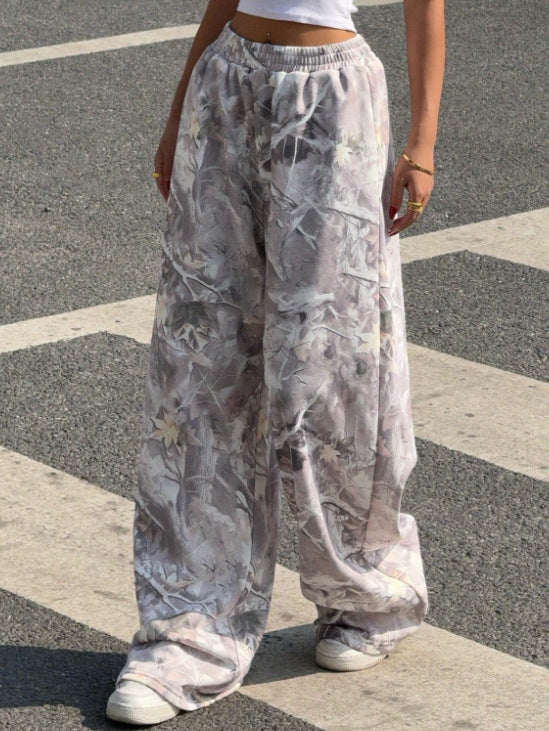 Women's wide Palazzo pants with floral all-over print and elastic waistband Mune Fashion