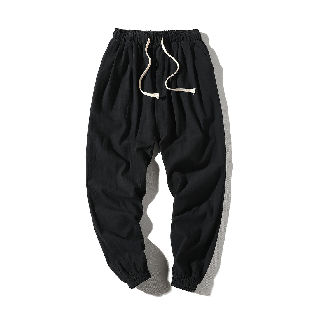 Men's loose joggers with elastic waistband, drawstring, side pockets, and elastic cuffs Mune Fashion