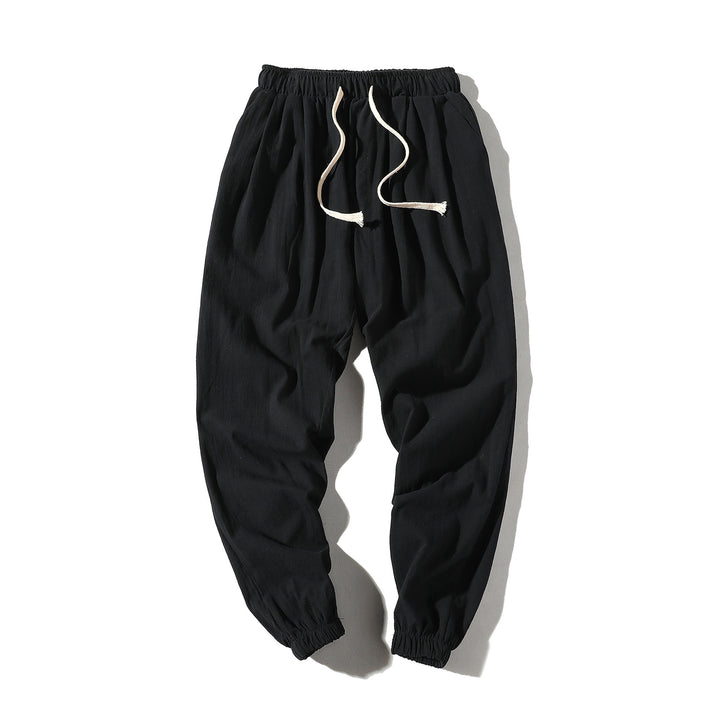 Men's loose joggers with elastic waistband, drawstring, side pockets, and elastic cuffs Mune Fashion
