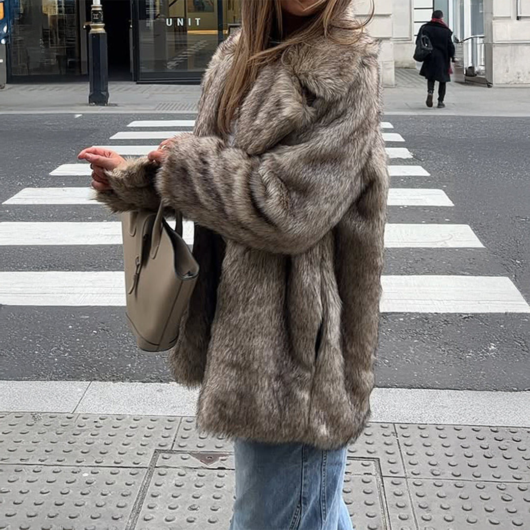 Women's short faux fur jacket with standing collar, concealed zipper and wide sleeves Mune Fashion