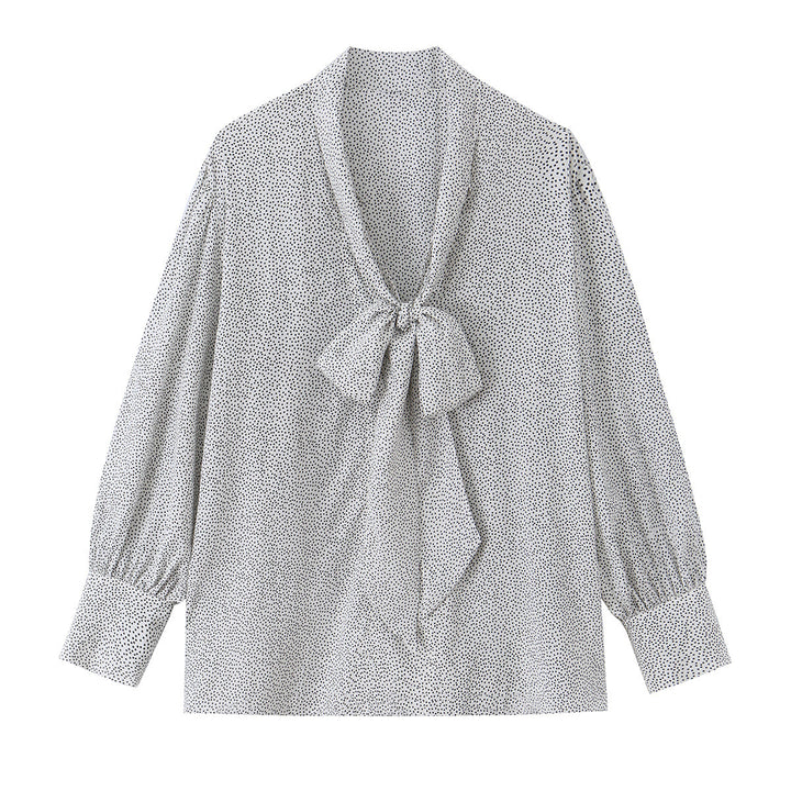 Ladies blouse with peplum and fine polka dot pattern, balloon sleeves and cuffs