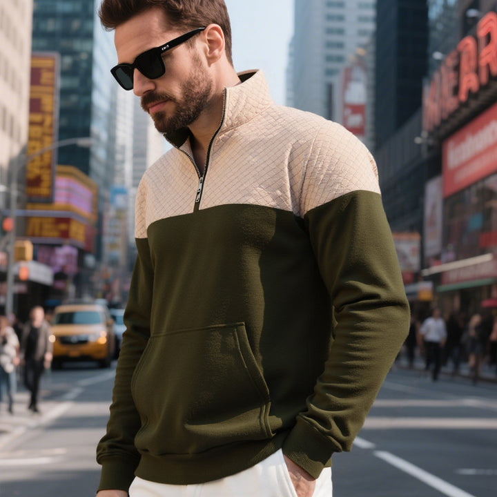 Men's color block half zip sweatshirt with quilted chest area, kangaroo pocket, and elastic cuffs Mune Fashion