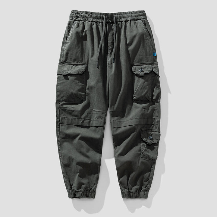 Herren Leichte Canvas-Cargohose im Joggerstil mit elastischem Bund, segmentierten Kniepaneelen und verdeckten Klappentaschen Mune Fashion