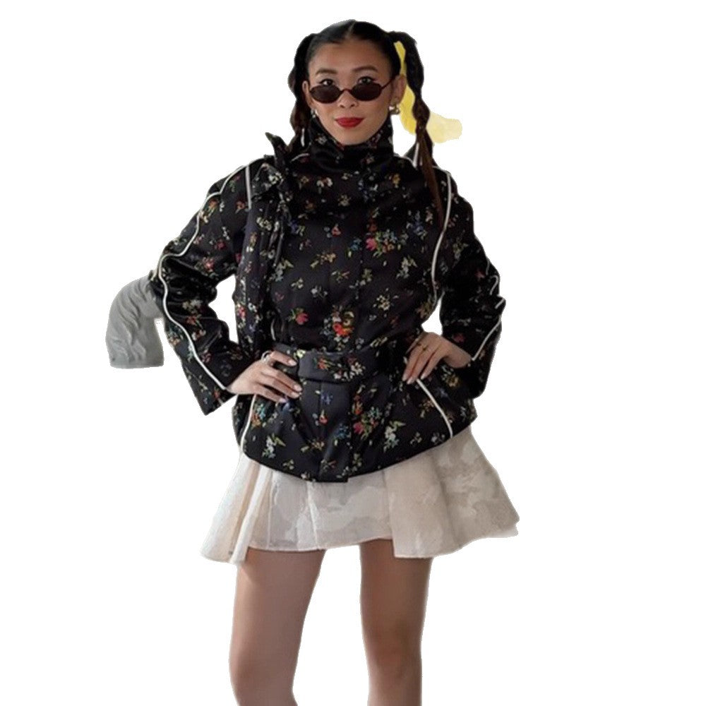 Women's short cut quilted blouson jacket with high standing collar, piping and floral all-over print Mune Fashion