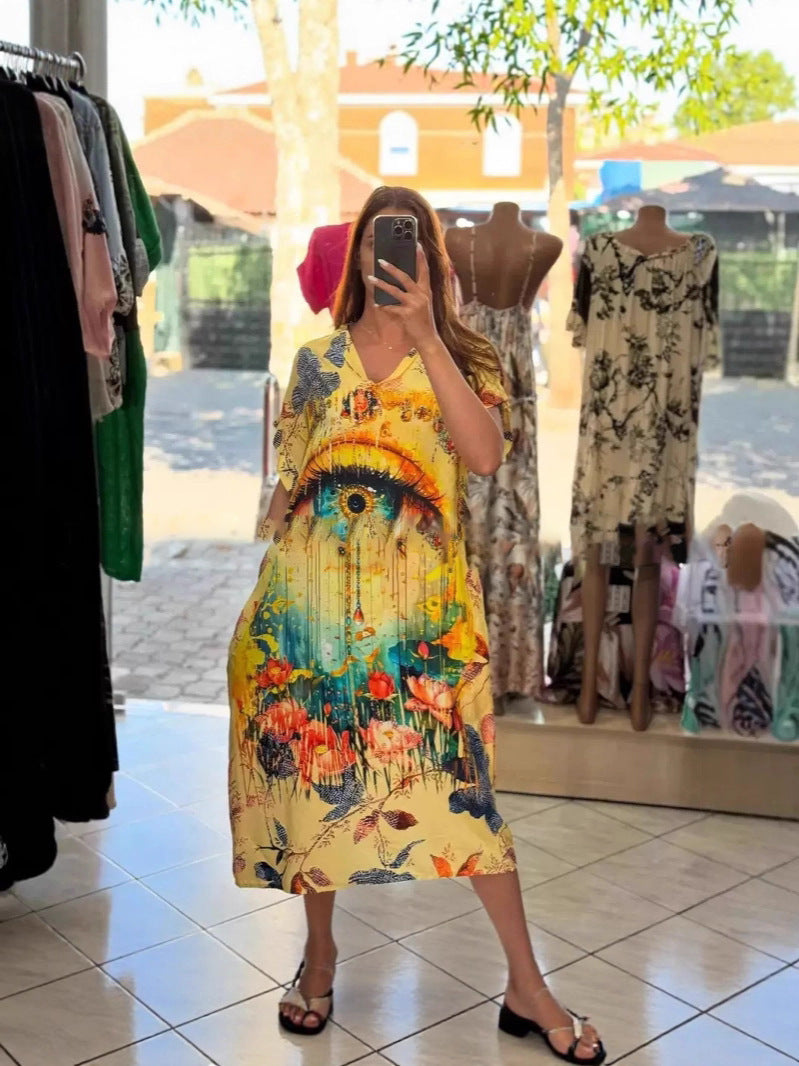 Women flowing maxi kaftan dress with V-neck and large watercolor floral print Mune Fashion