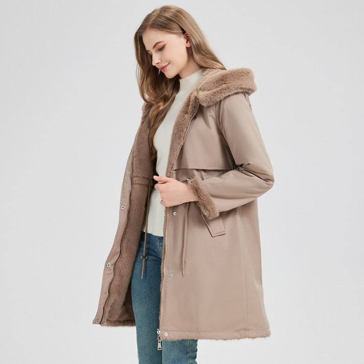 Women's tailored long thermal parka with faux fur trim on hood and sleeves as well as drawstring waist Mune Fashion