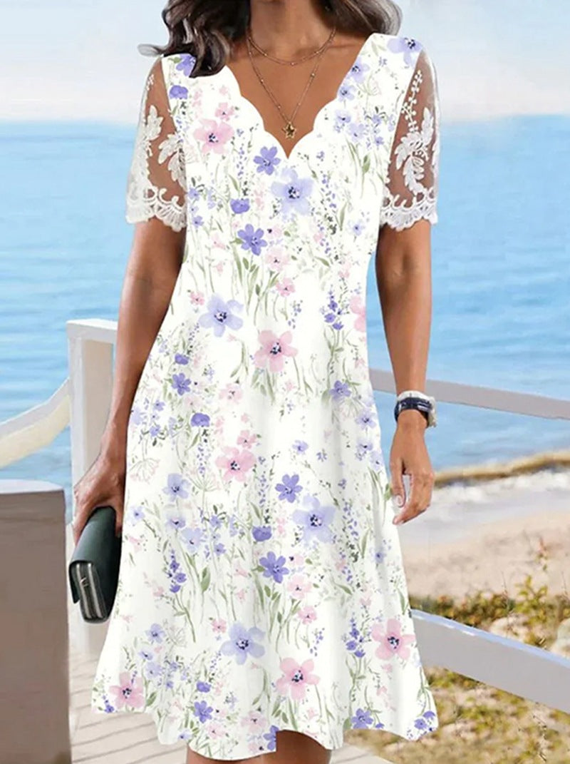 Women's A-line midi dress with wavy V-neck, all-over floral pattern and transparent lace sleeves Mune Fashion