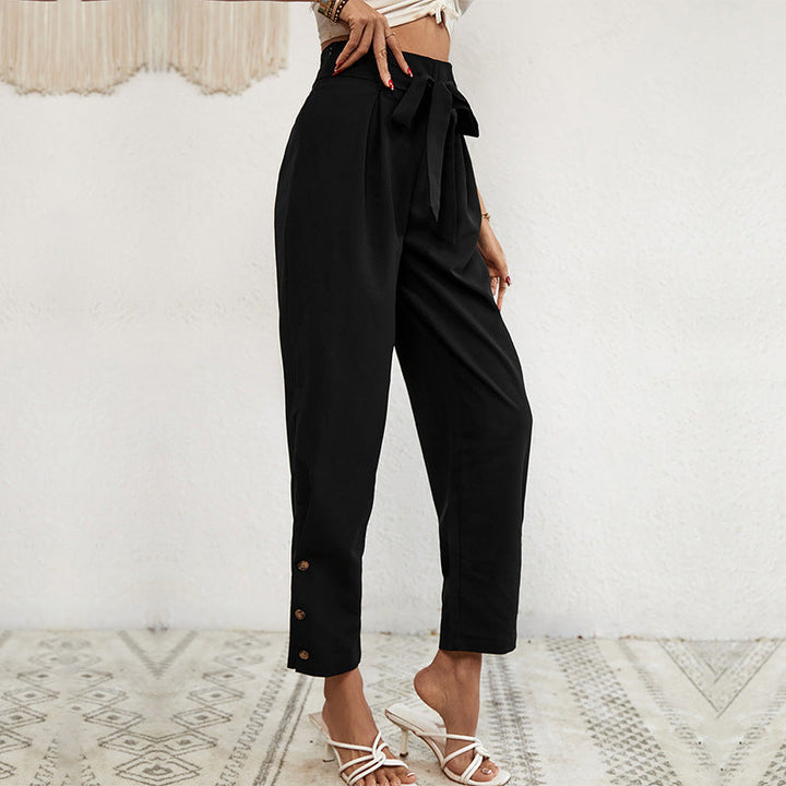 Ladies high-waisted paperbag trousers with tie belt, tapered leg and decorative button placket Mune Fashion