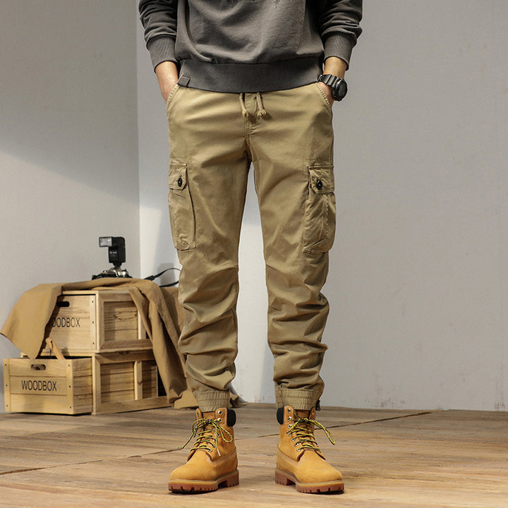 Men's robustly cut canvas cargo jogging pants with drawstring waist, knee patches, and elastic ankle cuffs Mune Fashion