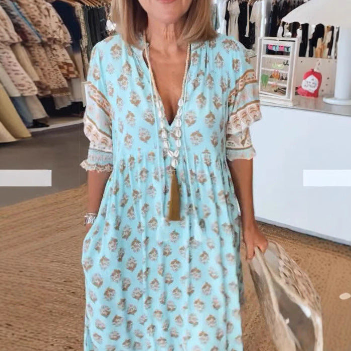 Women Boho Maxi Dress made of lightweight viscose blend with V-neck, tassel tie, three-quarter sleeves, and side pockets Mune Fashion