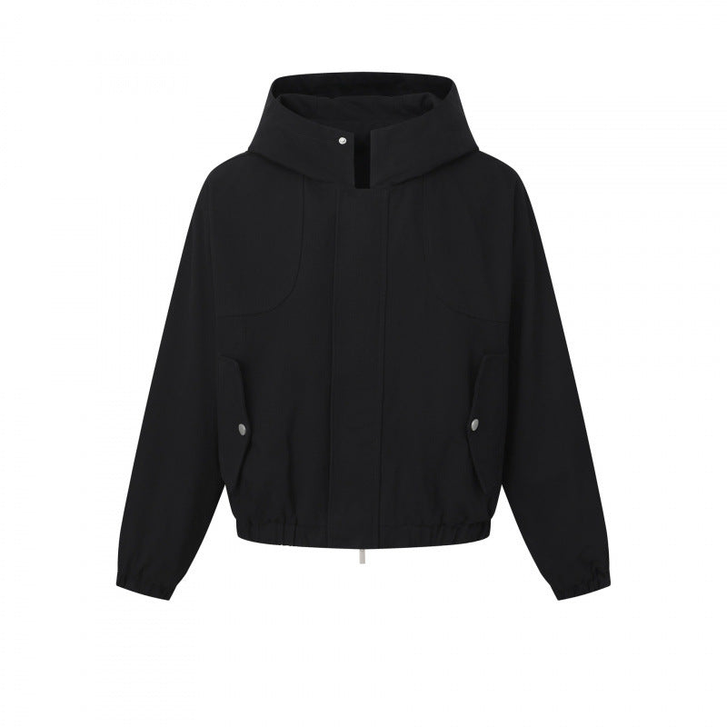 Ladies short cut hooded blouson jacket with textured fabric, patch pockets, and elastic hem Mune Fashion