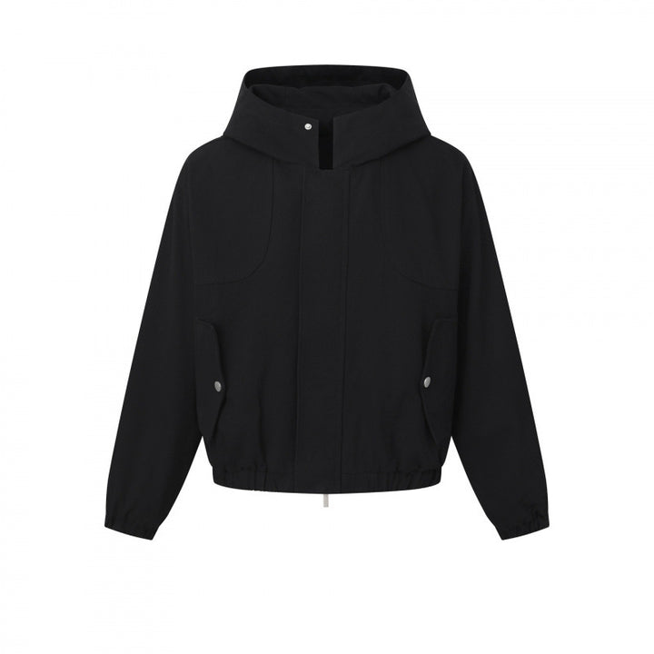 Ladies short cut hooded blouson jacket with textured fabric, patch pockets, and elastic hem Mune Fashion