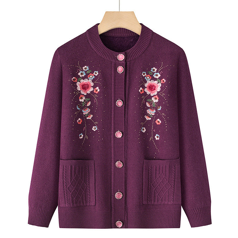 Women's embroidered cardigan with round neckline, decorative button placket, and patch pockets Mune Fashion