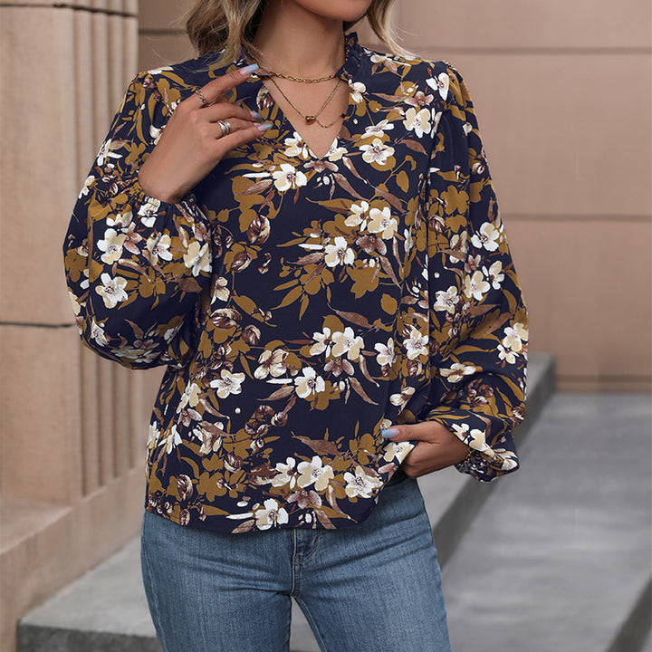 Women's lightweight chiffon blouse with floral all-over print, V-neck and voluminous gathered sleeves Mune Fashion