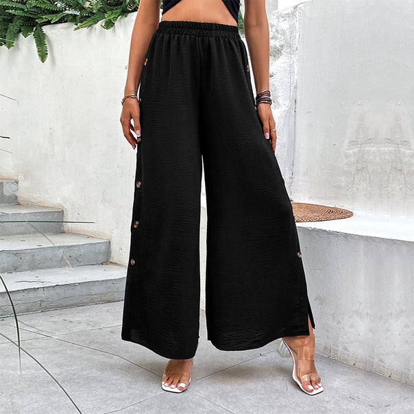 Women's wide palazzo pants with elastic waistband, side slit and decorative button placket Mune Fashion