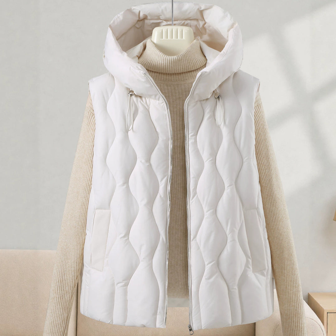 Women longer cut quilted vest with hood, wave quilting and detachable zipper Mune Fashion