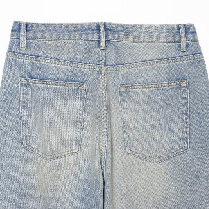 Women's jeans with a high waist, wide leg, rhinestone trim, and destroyed details Mune Fashion