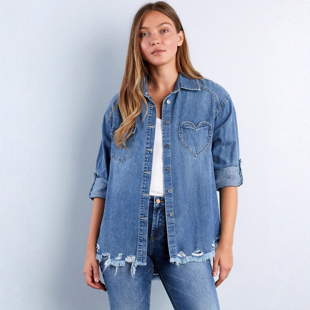 Women's casual denim shirt jacket oversized with patch chest pockets, heart embroidery detail, and frayed hem Mune Fashion