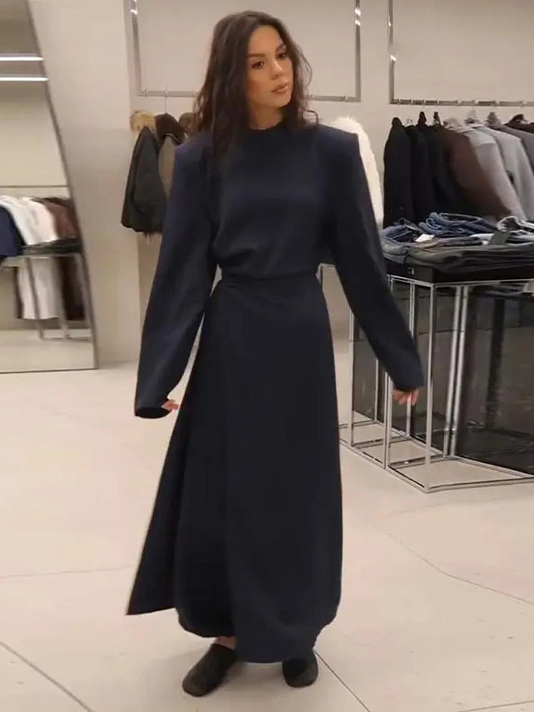 Women’s maxi dress with tailored silhouette, flared skirt and striking shoulders Mune Fashion