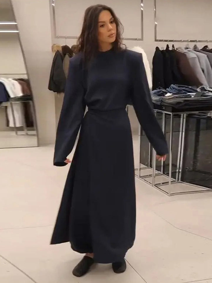 Women’s maxi dress with tailored silhouette, flared skirt and striking shoulders Mune Fashion