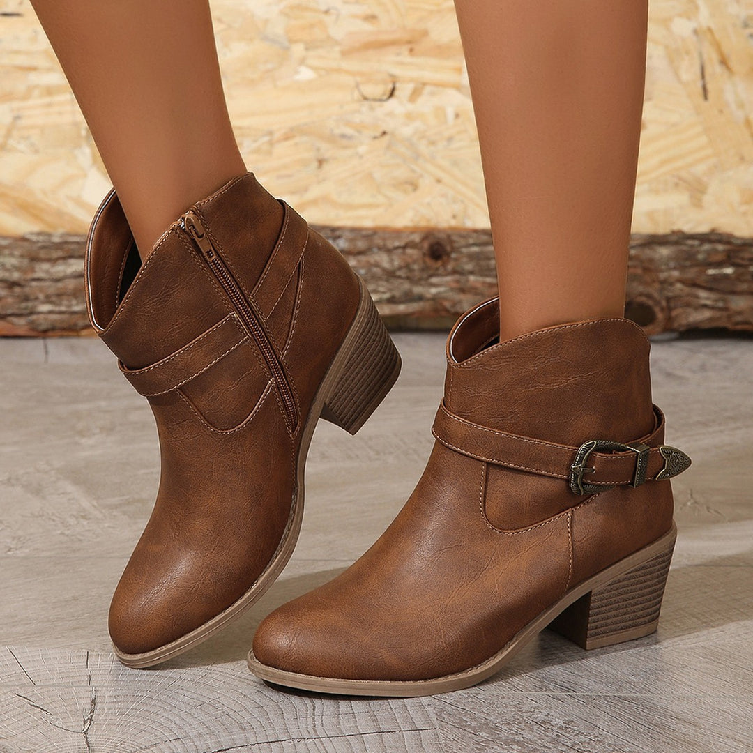 Women’s Western-inspired ankle boots with mid-height block heel, side zipper and decorative metal buckle Mune Fashion